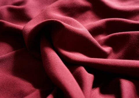 a close up view of a red fabric