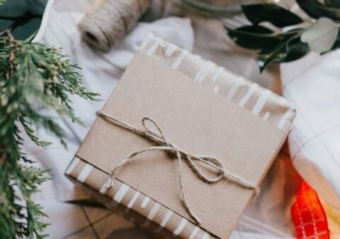 brown gift box on white and red checkered textile